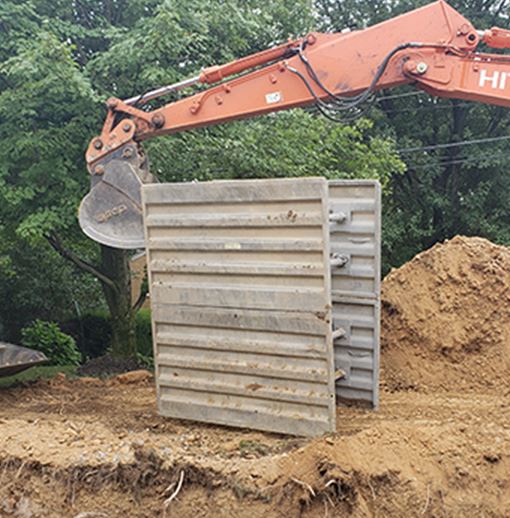 Placing barrier into trench